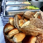 Fresh Bread Rolls And Serving Dishes